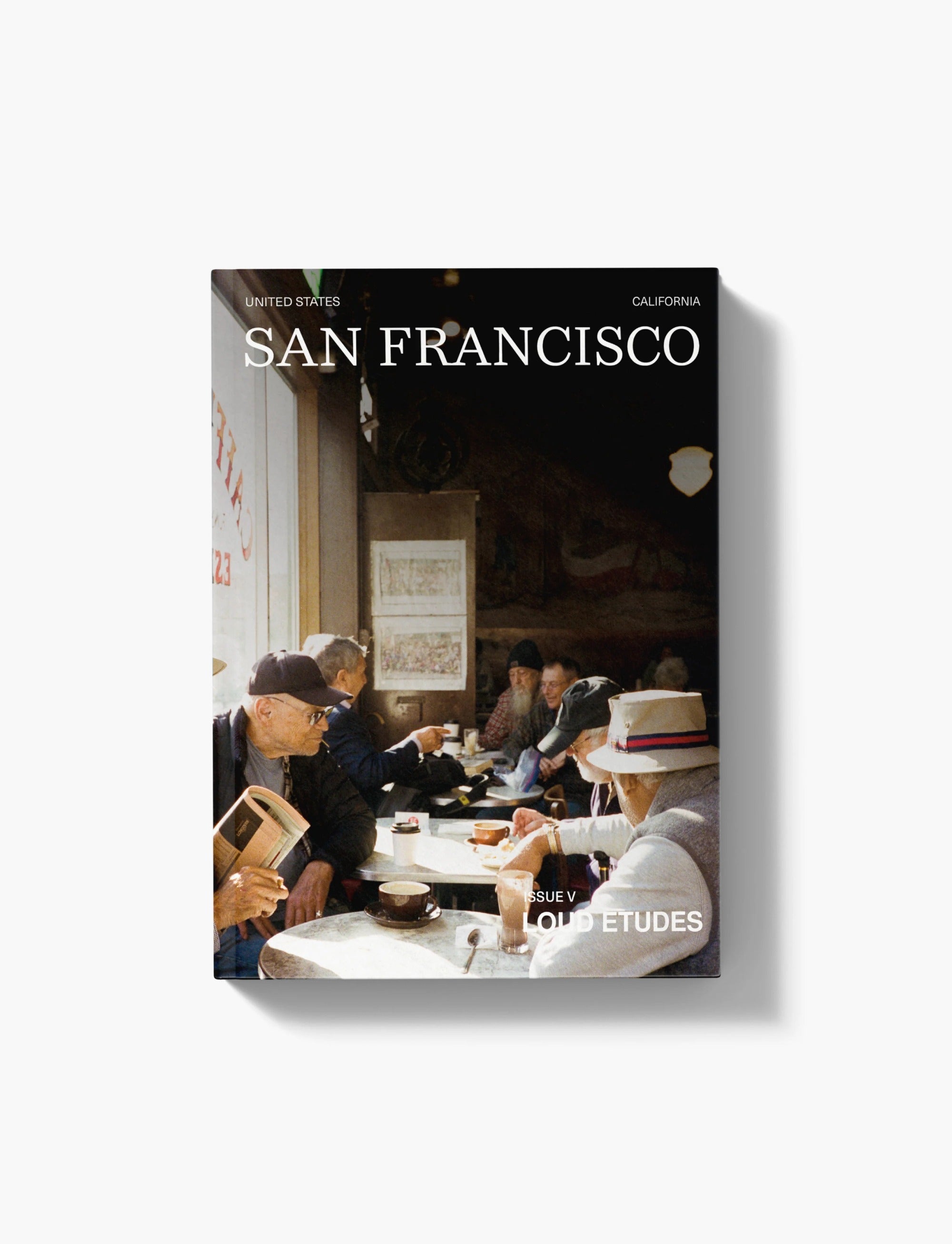 Travel guide titled 'San Francisco' with film photograph of men drinking coffee in San Francisco — Loud Etudes Travel Guide